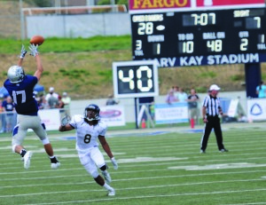 Senior Nate Weimers catches a pass in the second quarter of the team’s blowout victory over South Dakota School of Mines. The team will be traveling to William Jewell College this weekend.