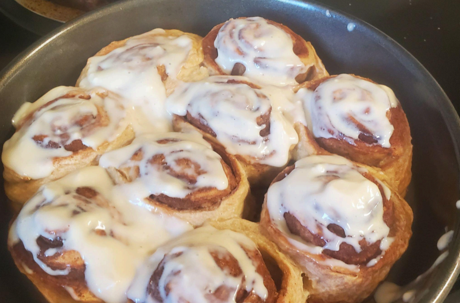 A photo of cinnamon rolls in a baking tin